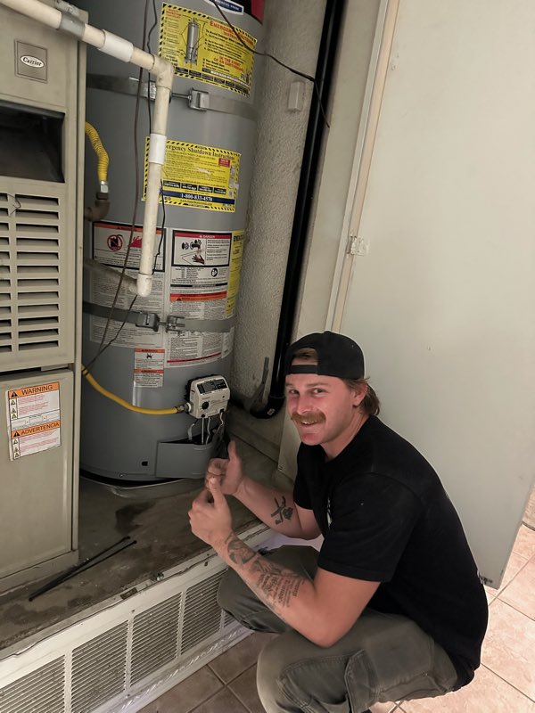 Postiff Plumbing and Drains plumber on a job